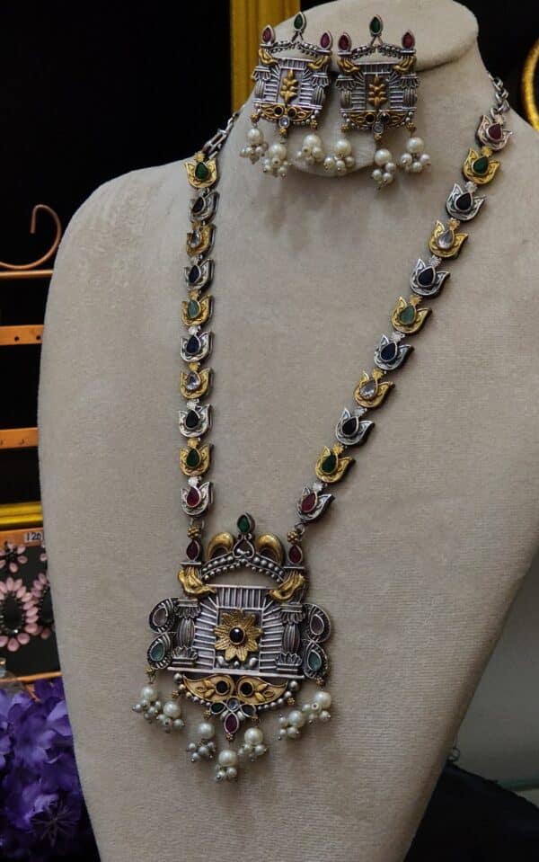 Close-up of jharokha pendant on multicolour temple necklace with twin bird motif
