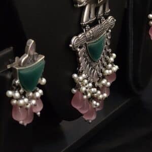 Oxidised elephant green stone necklace set with pearl and pink stone fringe