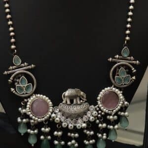Oxidised elephant pendant necklace set detail showing beaded chain and tribal-style medallions