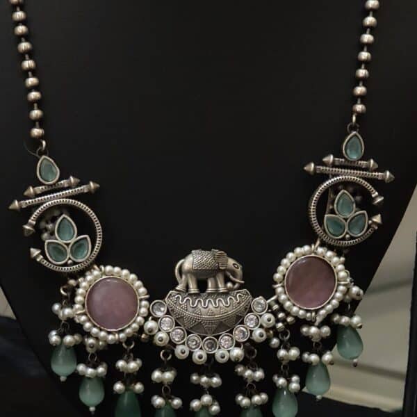 Oxidised elephant pendant necklace set detail showing beaded chain and tribal-style medallions