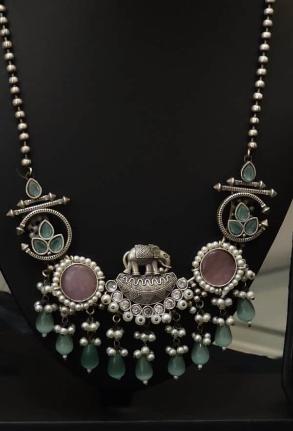 Oxidised elephant pendant necklace set detail showing beaded chain and tribal-style medallions
