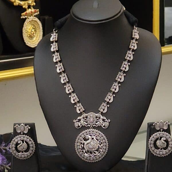 Oxidised brass peacock medallion necklace set with earrings in lavender stone