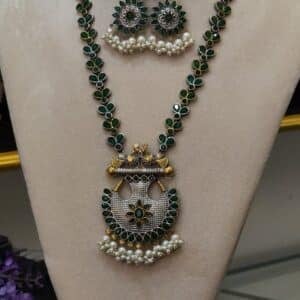 Victorian peacock necklace set with emerald green stones and pearl fringe