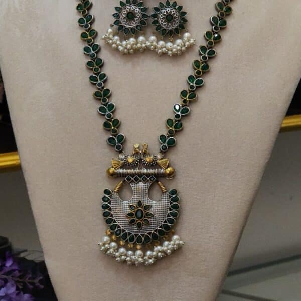 Victorian peacock necklace set with emerald green stones and pearl fringe