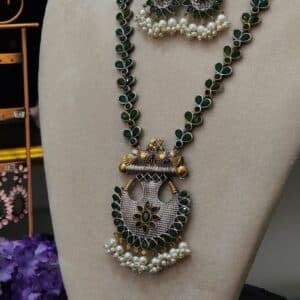 Side view of Victorian peacock necklace set showing floral link chain and pendant detail